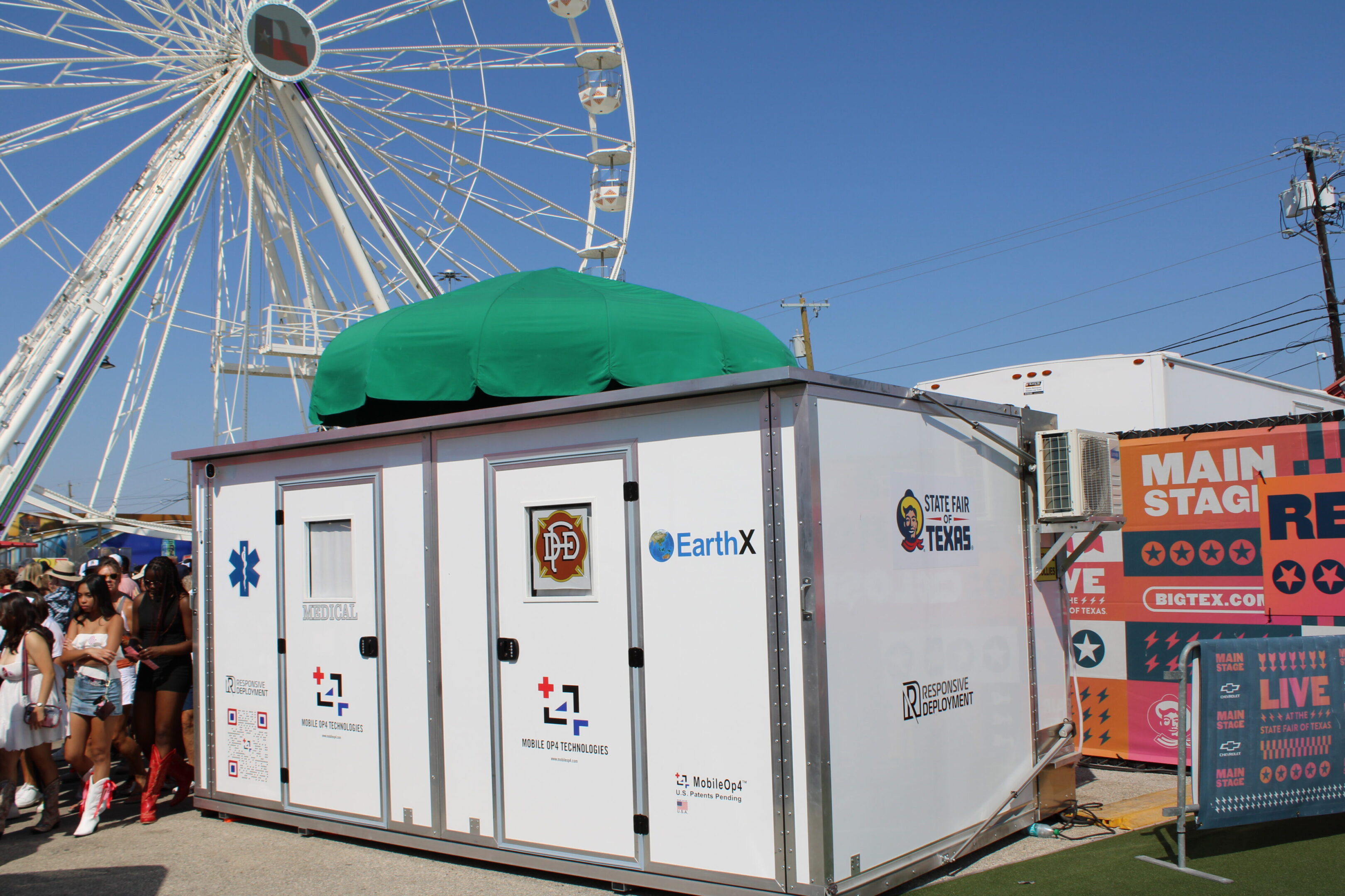 A white container with a green umbrella on top.