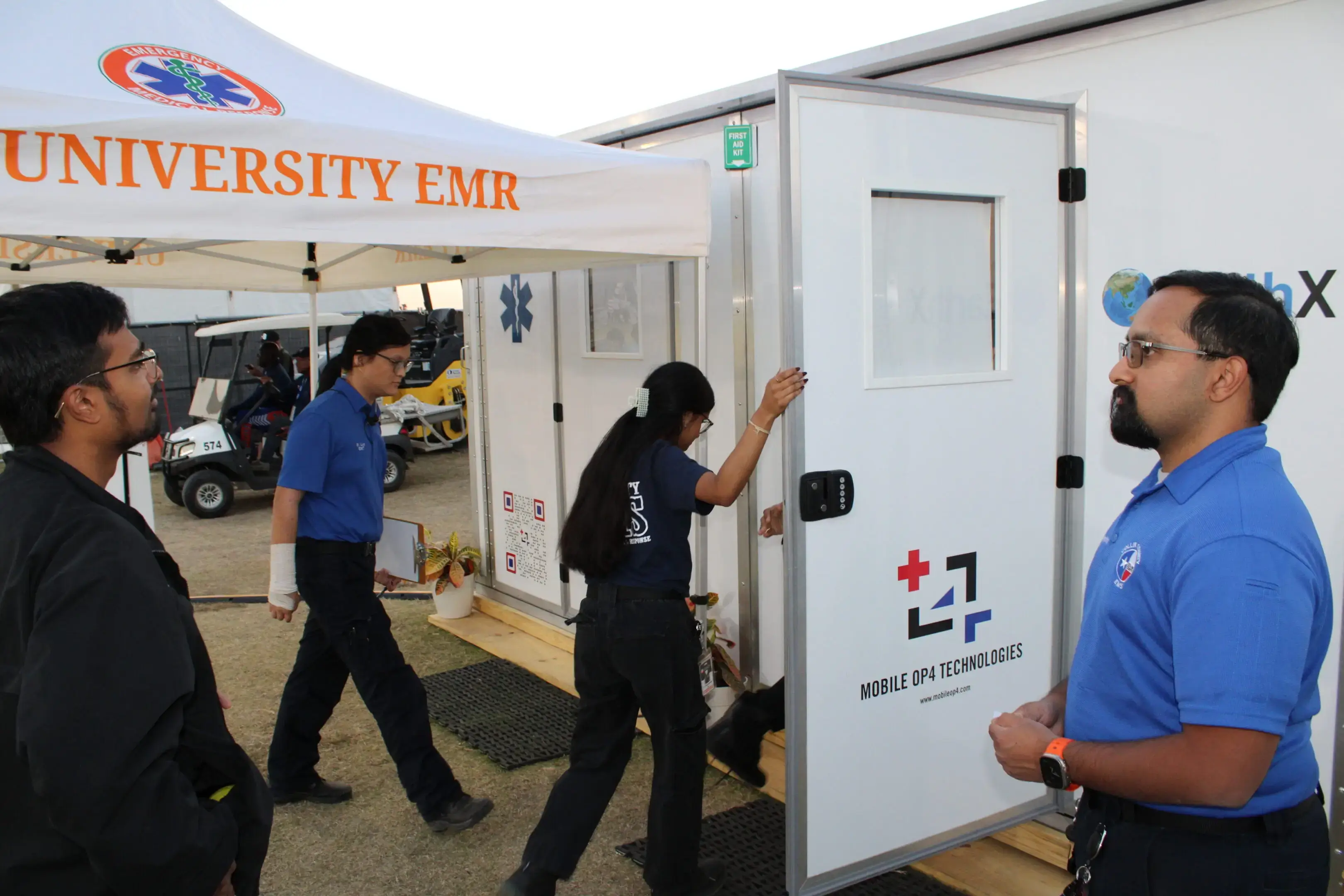 Medical staff entering a mobile emergency unit.